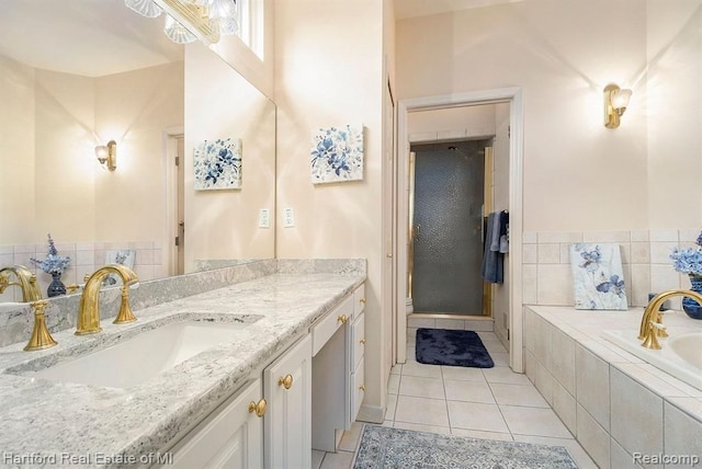 full bathroom featuring vanity, a bath, toilet, and tile patterned flooring