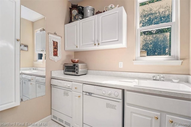 laundry room with a toaster and a sink