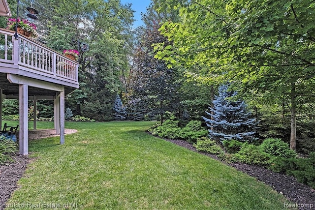 view of yard featuring a wooden deck