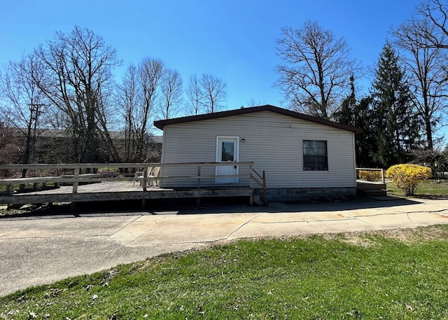 1877 S Almont Ave, Imlay City, MI 48444 - view of side of property featuring a deck
