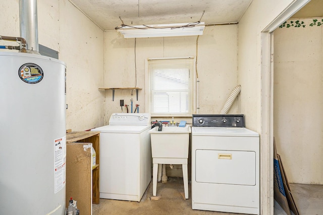 4302 Lake Dr, Beaverton, MI 48612 - washroom with water heater, independent washer and dryer, laundry area, and a sink