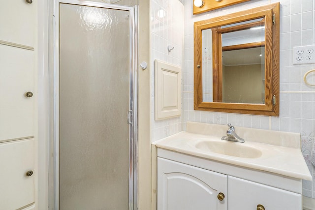 4302 Lake Dr, Beaverton, MI 48612 - bathroom with tile walls, decorative backsplash, vanity, and a shower stall