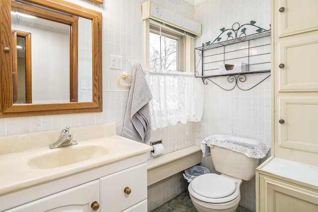 4302 Lake Dr, Beaverton, MI 48612 - half bath featuring tile walls, toilet, and vanity