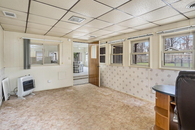 4302 Lake Dr, Beaverton, MI 48612 - living room featuring visible vents, carpet flooring, heating unit, and a drop ceiling