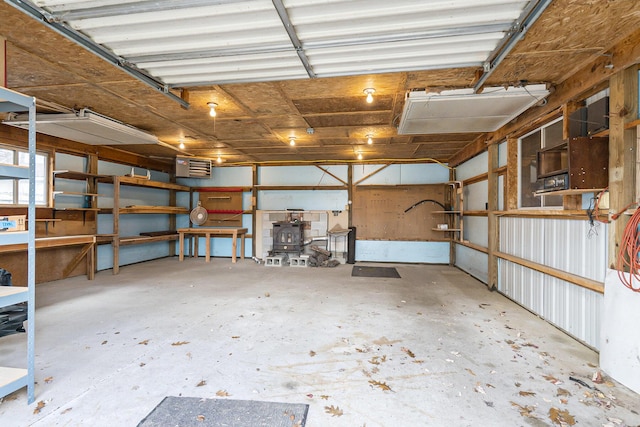 4302 Lake Dr, Beaverton, MI 48612 - garage featuring a wood stove
