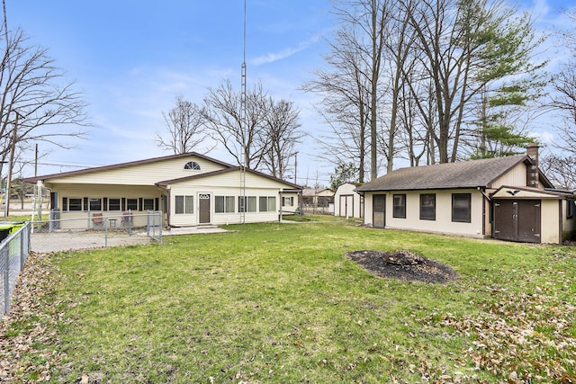 4302 Lake Dr, Beaverton, MI 48612 - exterior space featuring a fire pit, a shed, fence, and an outdoor structure
