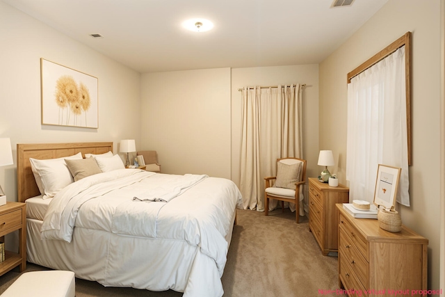 4302 Lake Dr, Beaverton, MI 48612 - bedroom with visible vents and light colored carpet