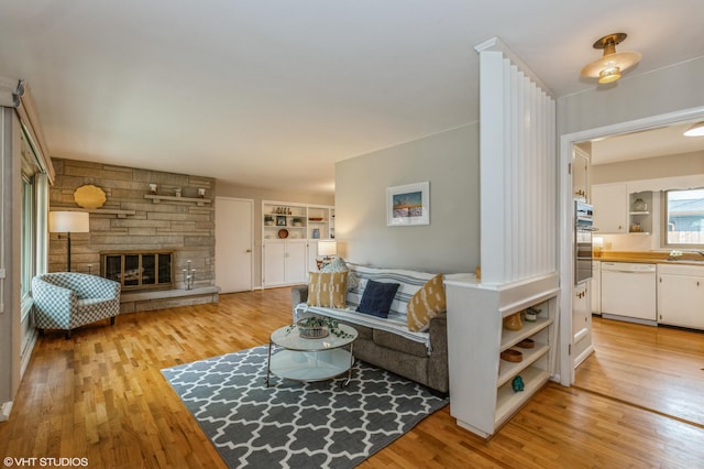 3105 Kevin St, Saint Joseph, MI 49085 - living area with light wood finished floors and a fireplace