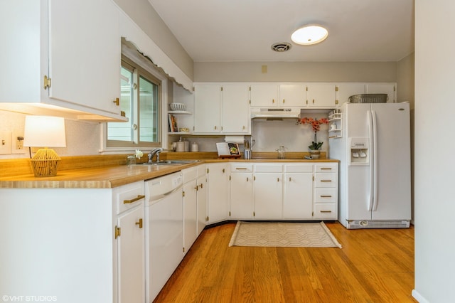 3105 Kevin St, Saint Joseph, MI 49085 - kitchen with a sink, light wood-style floors, white appliances, white cabinets, and under cabinet range hood