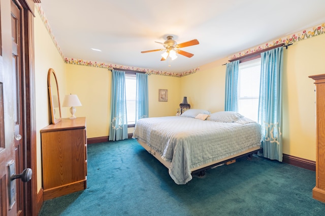 carpeted bedroom featuring ceiling fan and baseboards