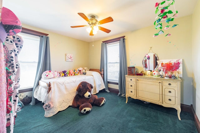 bedroom featuring dark carpet and ceiling fan