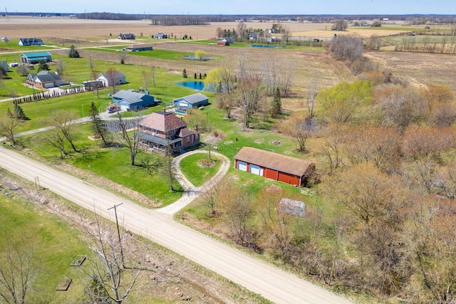 birds eye view of property featuring a rural view