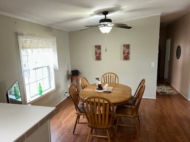 326 Basket Br, Oxford, MI 48371 - dining area featuring wood finished floors, crown molding, baseboards, and ceiling fan