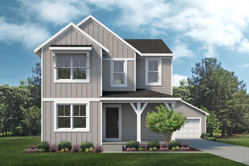 view of front facade with driveway, roof with shingles, board and batten siding, and a front yard