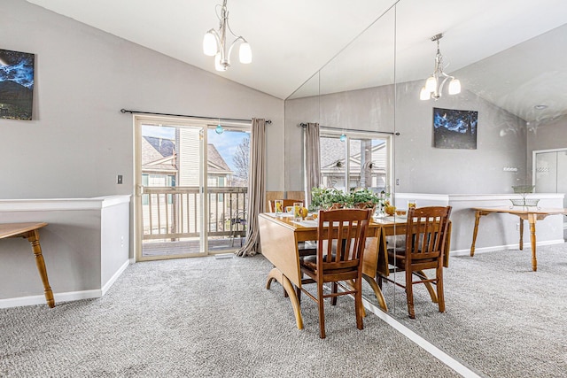 dining area featuring lofted ceiling, baseboards, and carpet