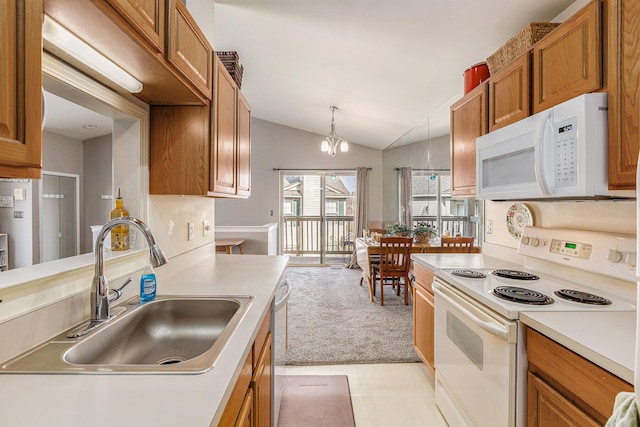 kitchen with a sink, brown cabinetry, white appliances, light countertops, and lofted ceiling