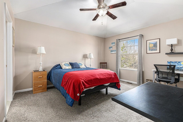 carpeted bedroom with a ceiling fan and baseboards