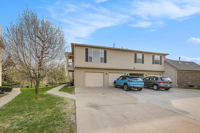 view of front facade with a garage, cooling unit, driveway, and a front yard