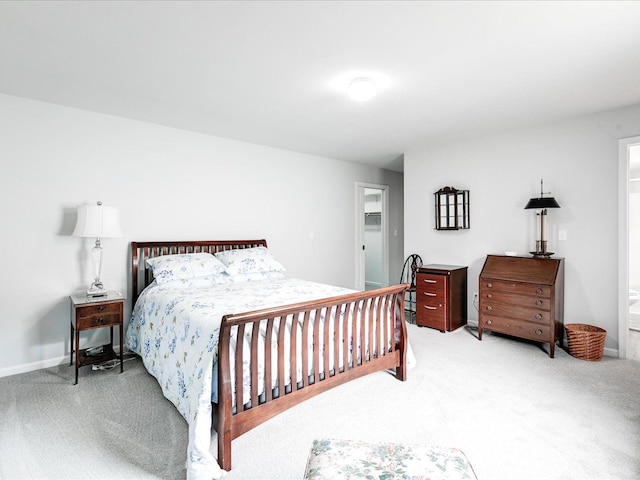 bedroom featuring baseboards and carpet floors