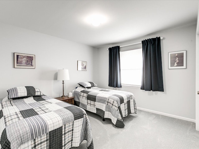 carpeted bedroom with baseboards