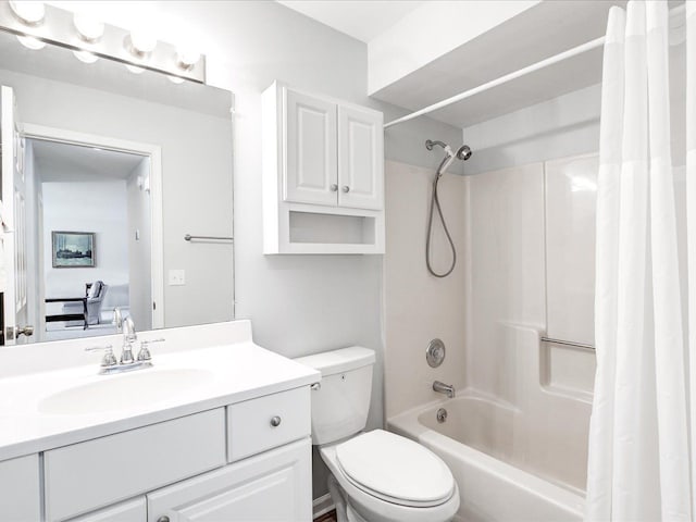 full bath with toilet, connected bathroom, shower / tub combo, and vanity