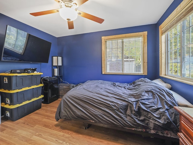 bedroom with wood finished floors and a ceiling fan