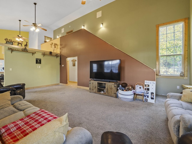 living room featuring visible vents, a ceiling fan, carpet floors, baseboards, and high vaulted ceiling