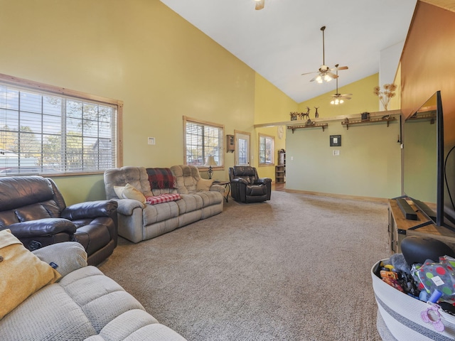 living area featuring carpet, baseboards, high vaulted ceiling, and ceiling fan