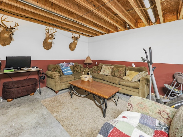 living room with unfinished concrete flooring