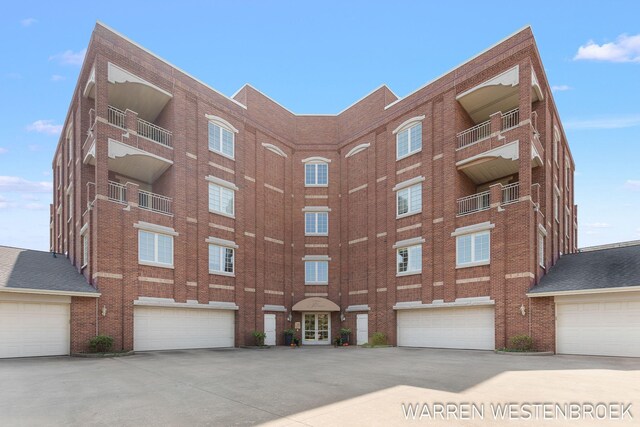 141 Central Ave Unit 110, Holland, MI 49423 - view of building exterior with concrete driveway