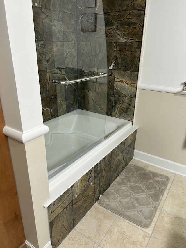 141 Central Ave Unit 110, Holland, MI 49423 - full bath featuring baseboards and tiled shower / bath