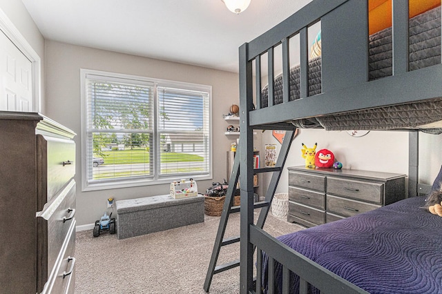 carpeted bedroom with baseboards
