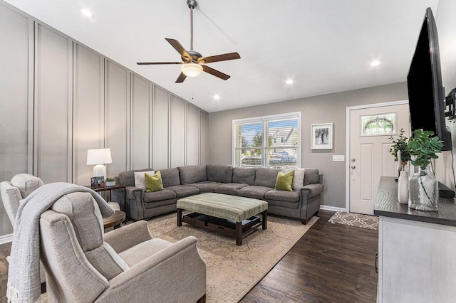 living room featuring recessed lighting, a ceiling fan, dark wood-style flooring, and baseboards