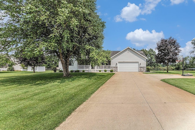view of front of property featuring covered porch, a front lawn, concrete driveway, an attached garage, and stone siding