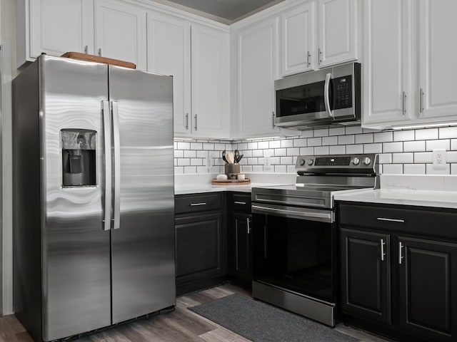 41698 Brownstone Dr, Novi, MI 48377 - kitchen with light countertops, dark cabinetry, appliances with stainless steel finishes, and white cabinetry