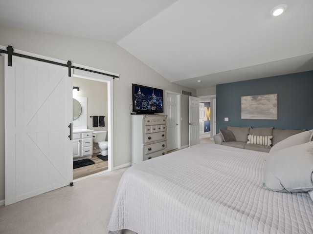 41698 Brownstone Dr, Novi, MI 48377 - bedroom featuring a barn door, vaulted ceiling, baseboards, light colored carpet, and ensuite bathroom