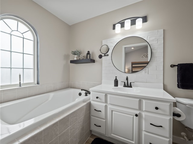 41698 Brownstone Dr, Novi, MI 48377 - full bathroom with a bath, decorative backsplash, toilet, and vanity