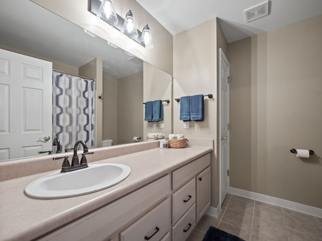 41698 Brownstone Dr, Novi, MI 48377 - full bath with tile patterned flooring, visible vents, toilet, vanity, and baseboards