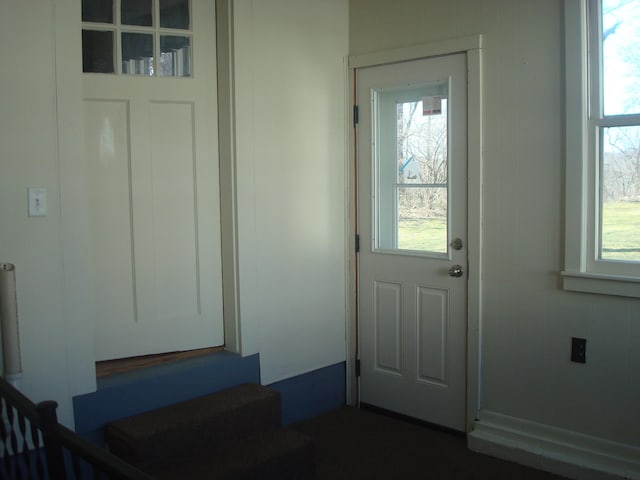 doorway to outside featuring stairs