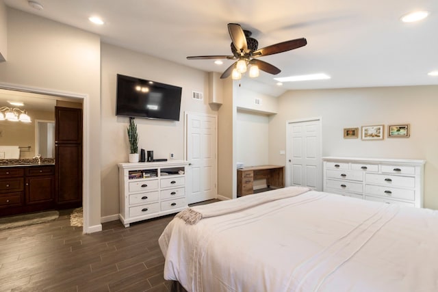 bedroom featuring recessed lighting, lofted ceiling, baseboards, visible vents, and dark wood-style floors