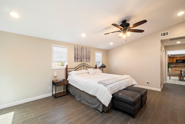 bedroom with visible vents, baseboards, recessed lighting, vaulted ceiling, and dark wood finished floors