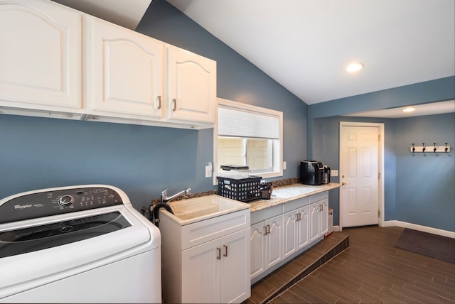 washroom featuring washer / clothes dryer, a sink, dark wood-style floors, recessed lighting, and cabinet space