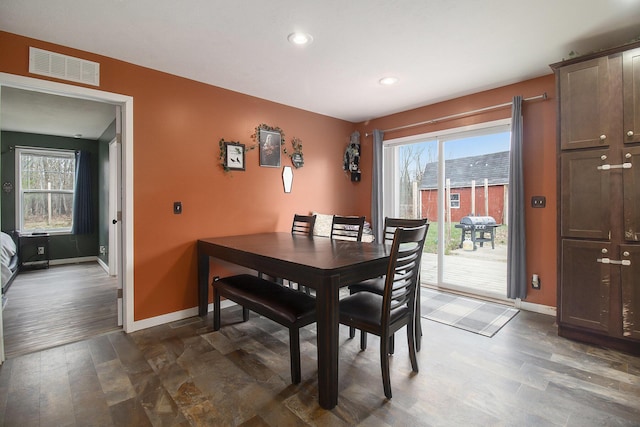 dining area with recessed lighting, baseboards, visible vents, and plenty of natural light