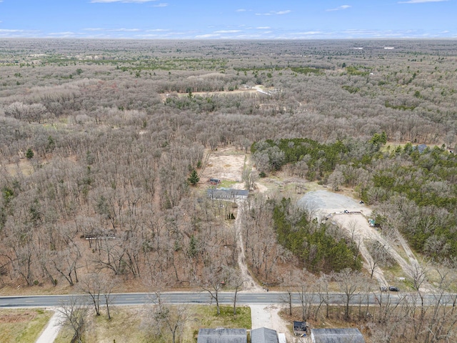 drone / aerial view with a view of trees