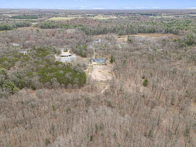 drone / aerial view featuring a view of trees