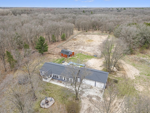 drone / aerial view with a rural view and a wooded view