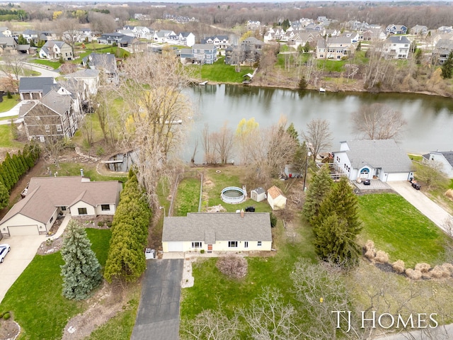 birds eye view of property featuring a residential view and a water view