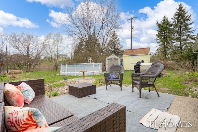 view of patio / terrace featuring an outdoor pool, an outdoor structure, an outdoor living space, and a storage shed