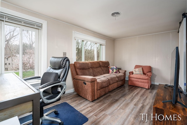 office area with visible vents, wood finished floors, and ornamental molding