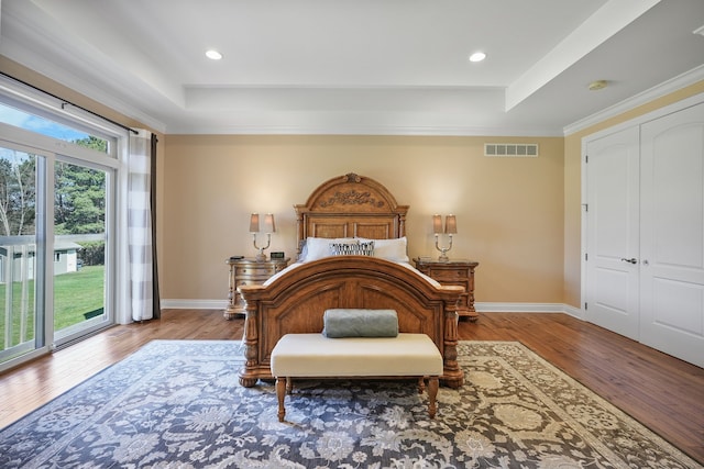 70799 Fisher Rd, Bruce, MI 48065 - bedroom featuring baseboards, visible vents, access to exterior, and a tray ceiling